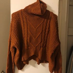 Cableknit turtleneck sweater